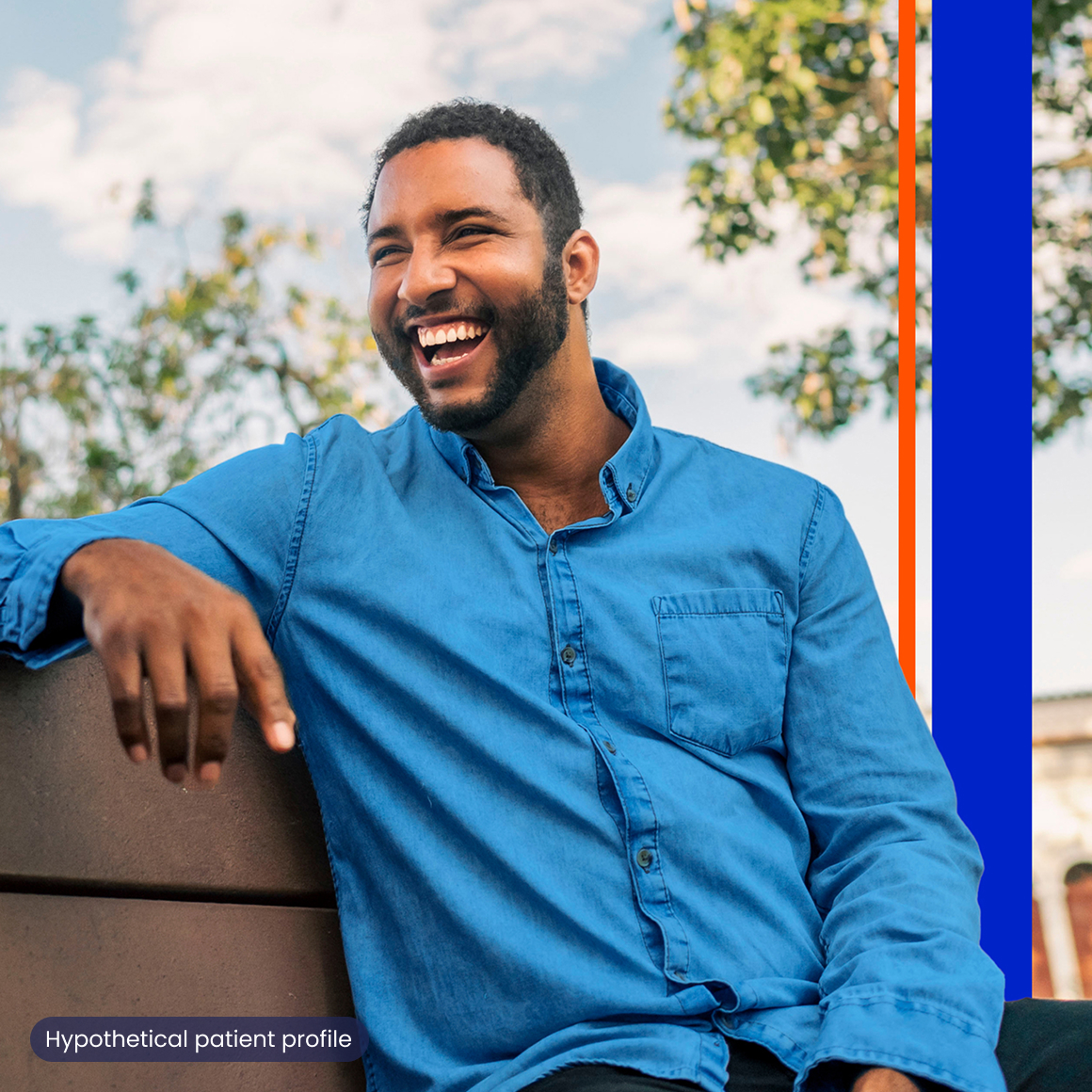A man sitting on a bench and laughing