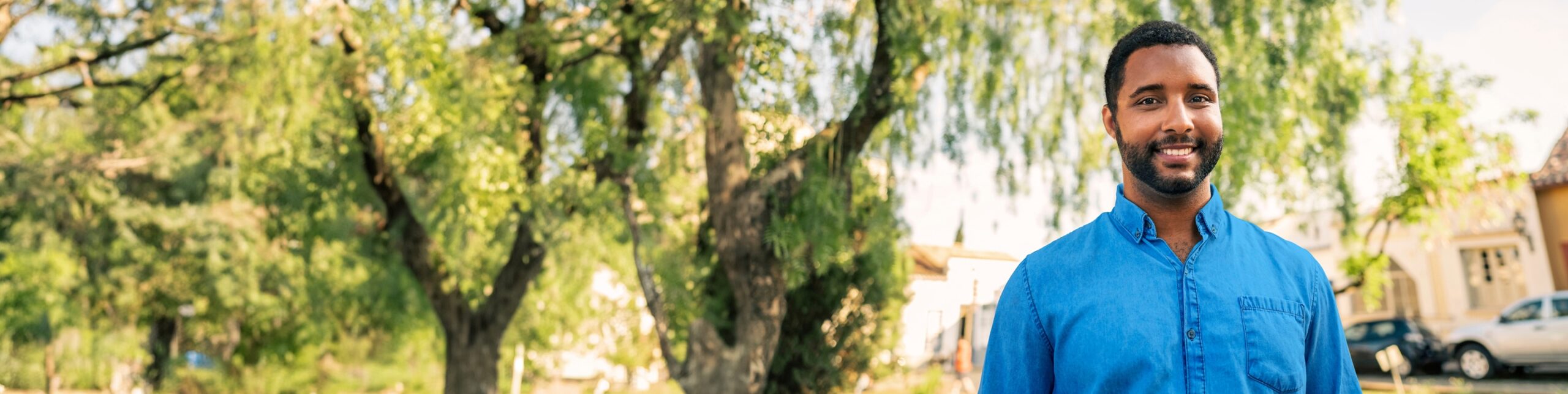 A man smiling outdoors